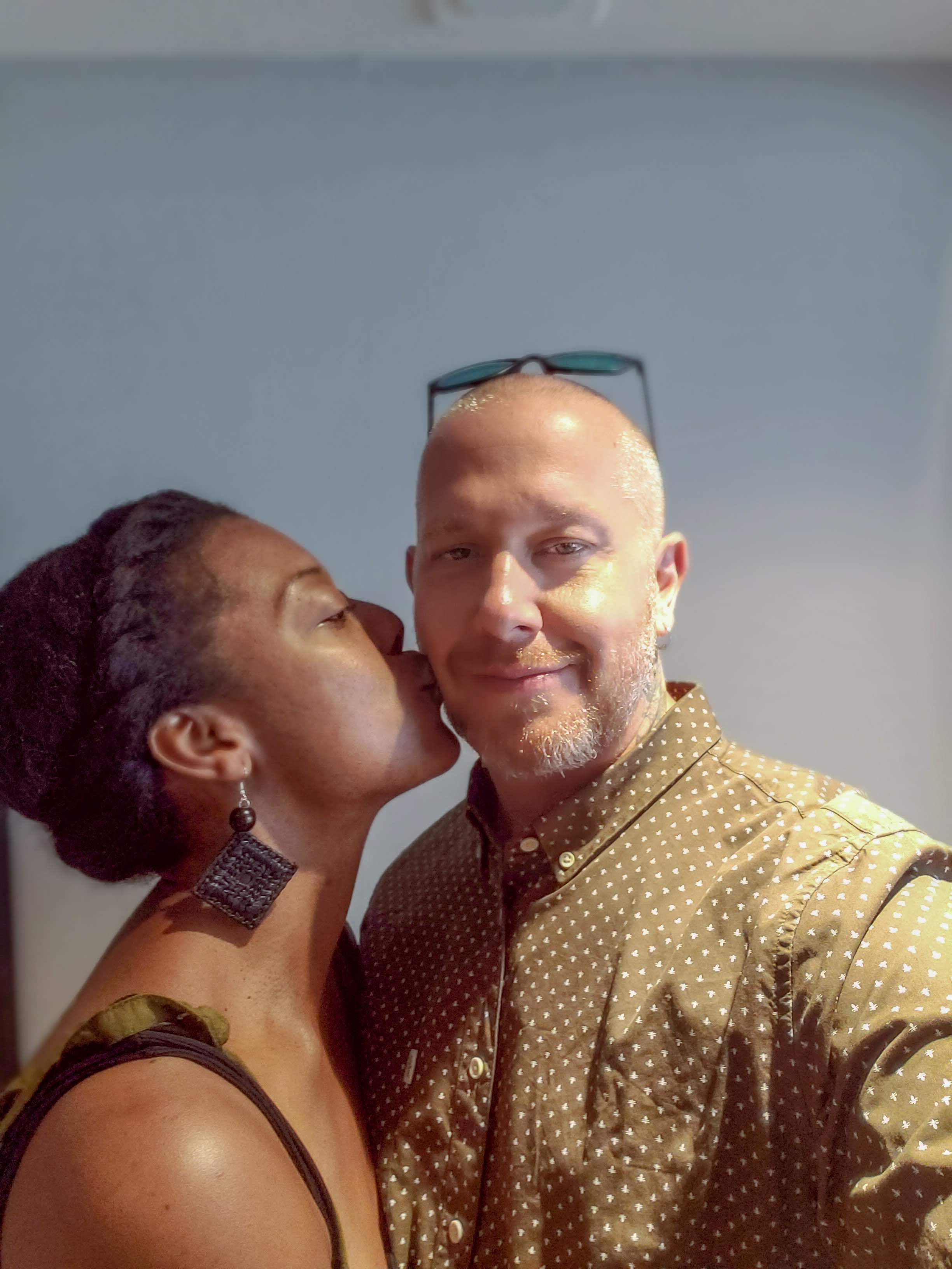 Keisha kissing Michael on the cheek